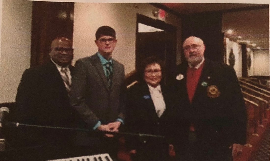 Image of Bryan Woolbert standing with Lions dignitaries, NJ.com, Link Graphic